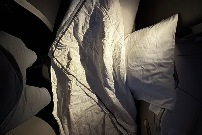 A clean and cozy lie-flat seat