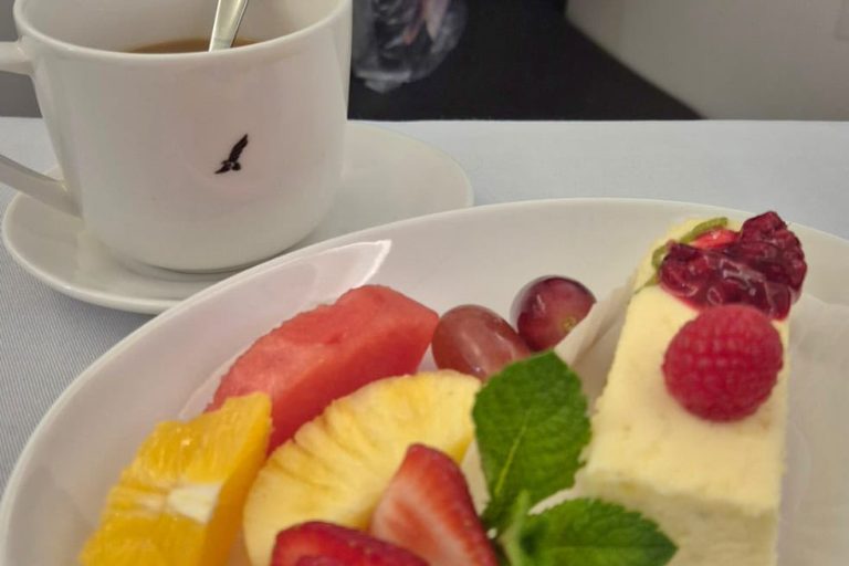 Arabic coffee with cheesecake and fresh fruits
